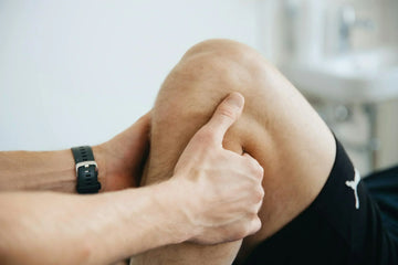 a person doing knee massage